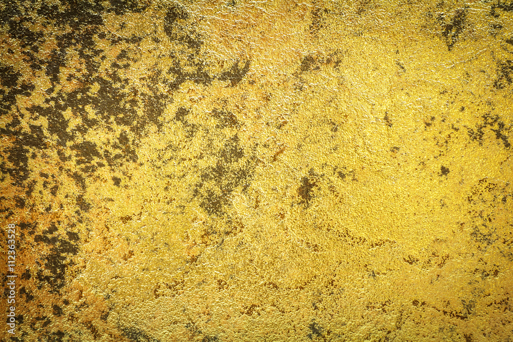 Abstract background texture of stone wall in yellow gold tone. Grunge wall. Cement wall texture and background with copy space for text or image. Dark edged. Abstract background texture of stone wall in yellow gold tone. Grunge wall. Cement wall texture and background with copy space for text or image. Dark edged.