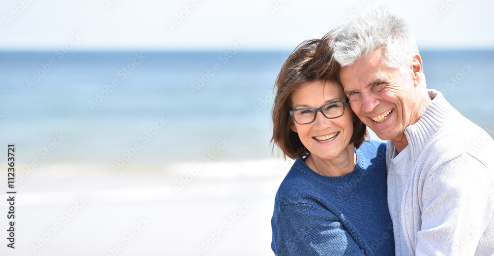 Senior couple embracing each other at the beach Senior couple embracing each other at the beach
