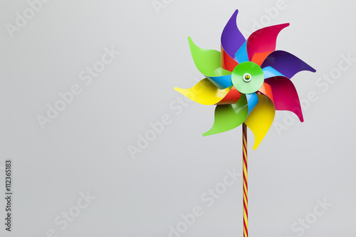 Colorful pinwheel isolated on grey background