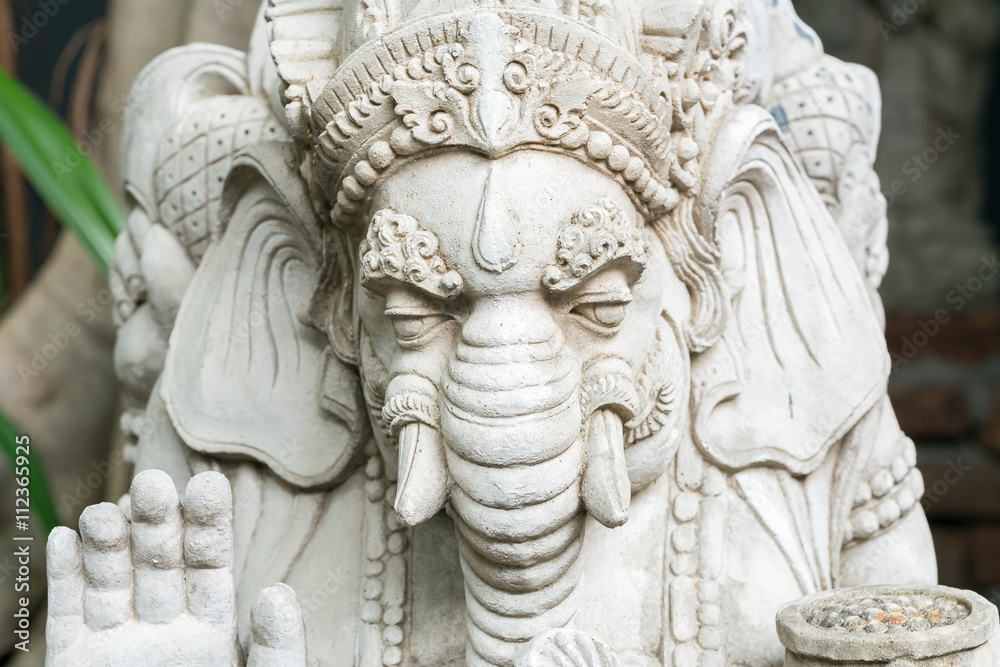 Old stone statue of Ganesha - a hindu symbol of luck in the jungle Old stone statue of Ganesha - a hindu symbol of luck in the jungle