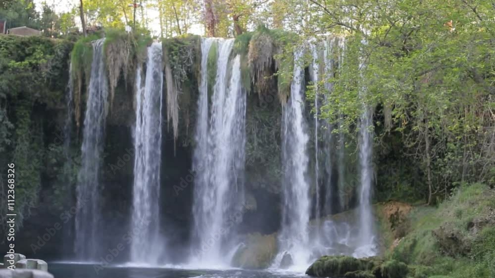 Large waterfall in the park in the summer Large waterfall in the park in the summer