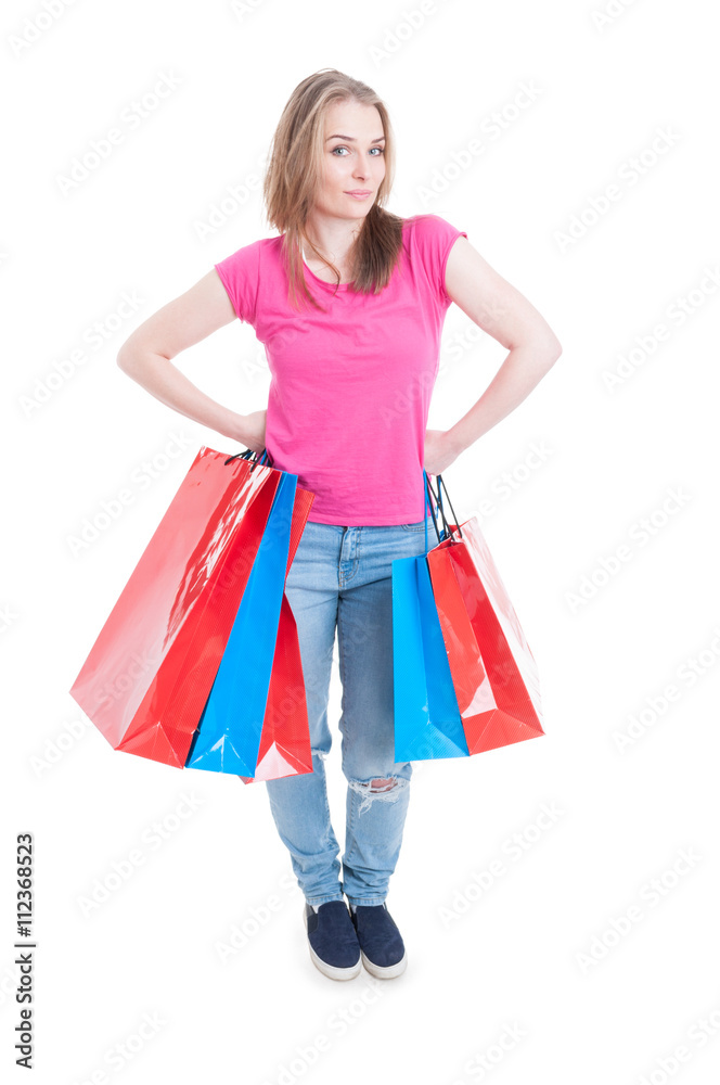 Confident young shopper holding shopping bags in her hands