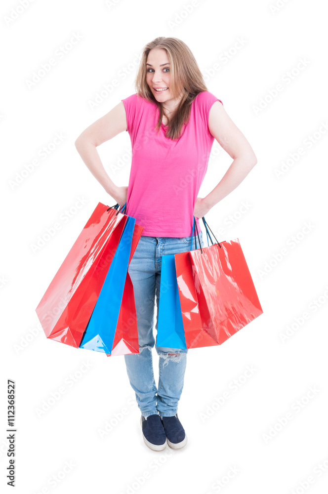 Cheerful pretty customer holding bags and acting funny on shoppi