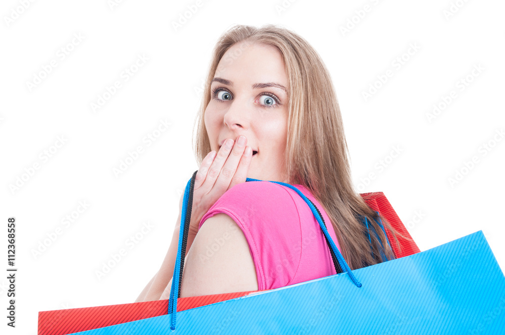 Closeup of amazed young girl with shopping bags Closeup of amazed young girl with shopping bags
