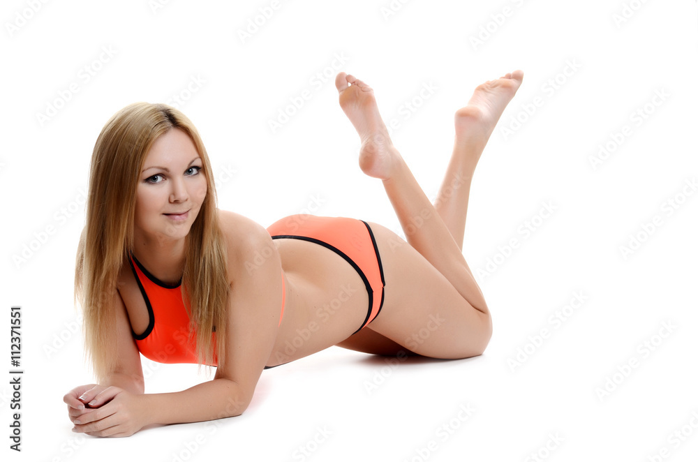 Beautiful girl in orange bathing suit with a smile Beautiful girl in orange bathing suit with a smile