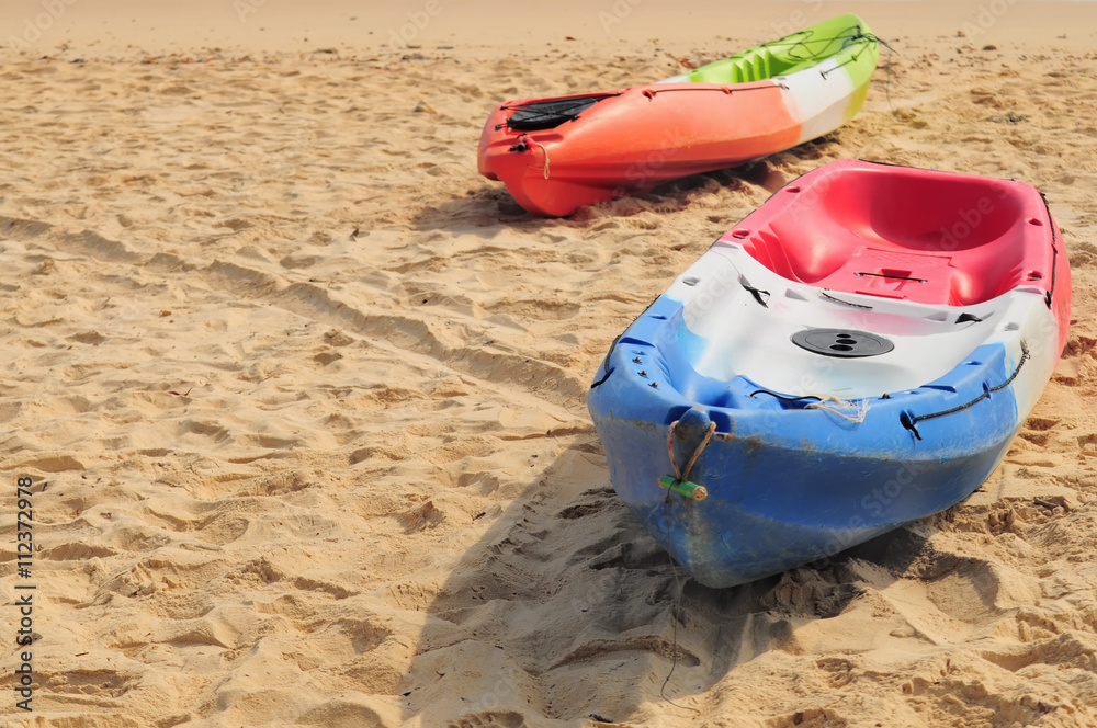 Kayak boat on tropical beach background, happy summer holiday concept Kayak boat on tropical beach background, happy summer holiday concept