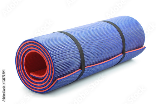 Rolled blue foam yoga mat photo