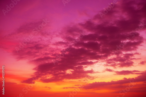 Colorful tropical sky with golden clouds at sunset time © nevodka.com