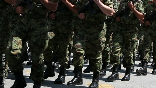 soldiers marching with rifles
