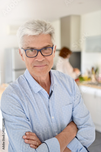 Portrait of smiling senior man with eyeglasses