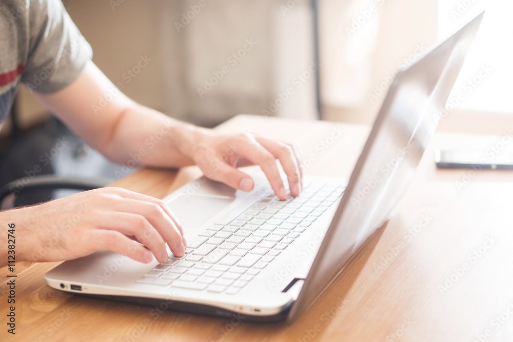 Hands typing on a notebook closeup. Workplace Hands typing on a notebook closeup. Workplace