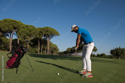 golf player hitting shot