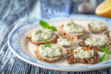 Plate with different bread with tzatziki on the blue table horizontal