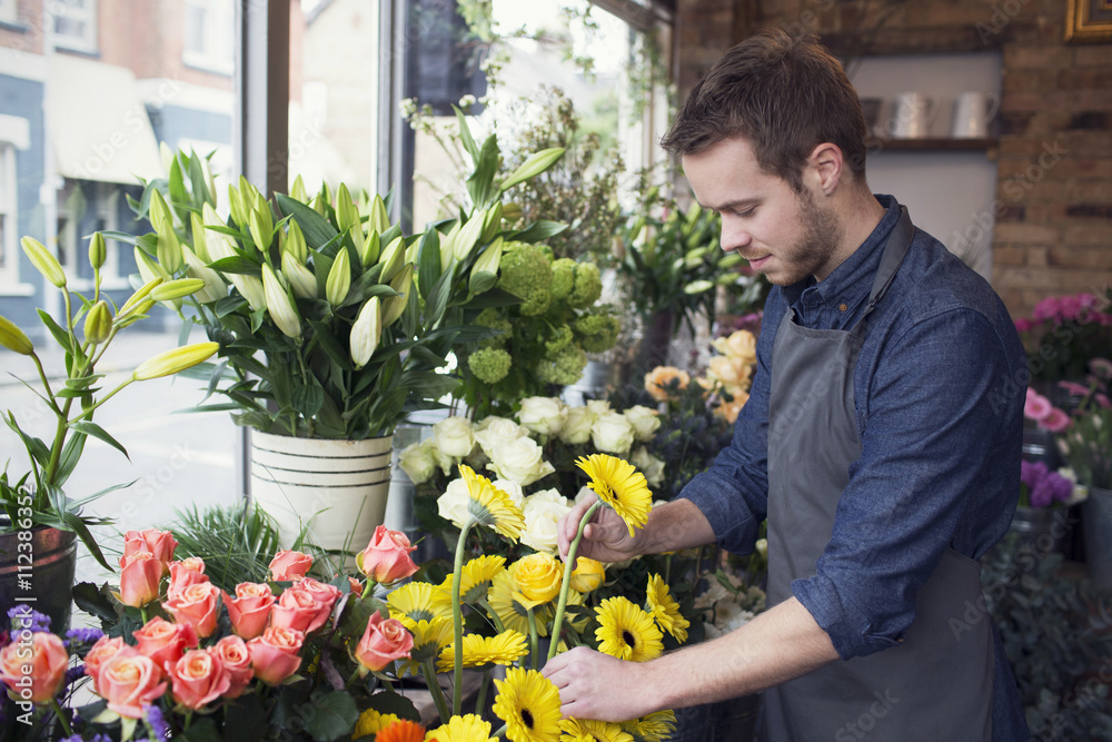 Male Florist At Work In Shop Male Florist At Work In Shop