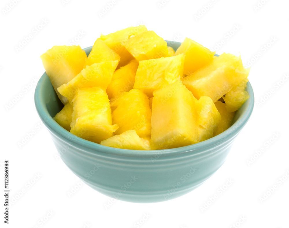 Fresh chunks of pineapple in a bowl Fresh chunks of pineapple in a bowl