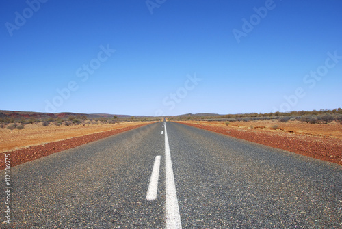 Long straight road through outback wasteland, Northern Territory, Australia