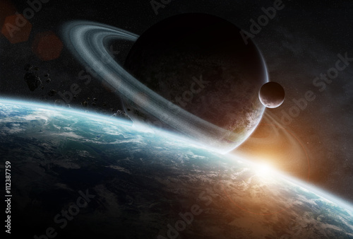 Fototapeta Naklejka Na Ścianę i Meble -  Sunrise over group of planets in space