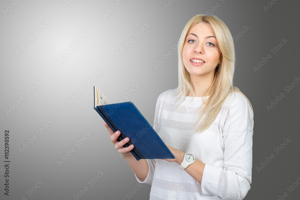 blonde businesswoman writing notes in the clipboard blonde businesswoman writing notes in the clipboard