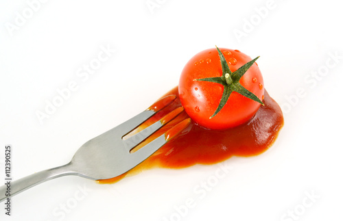 Tomato and ketchup with white background.
Vegetables and condiment that people around the world know and use it .