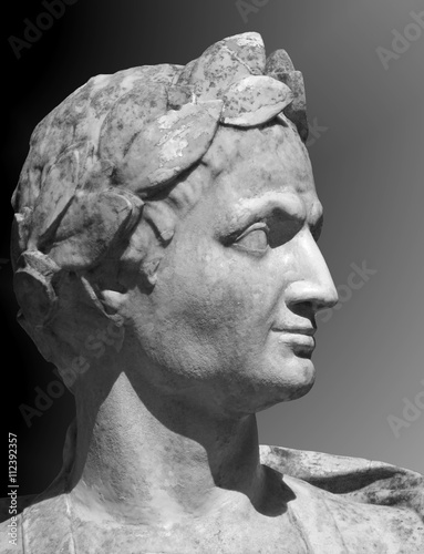 Gaius Julius Caesar sculpture on a gray background. Marble bust of  Roman general in the Summer Garden of Saint Petersburg