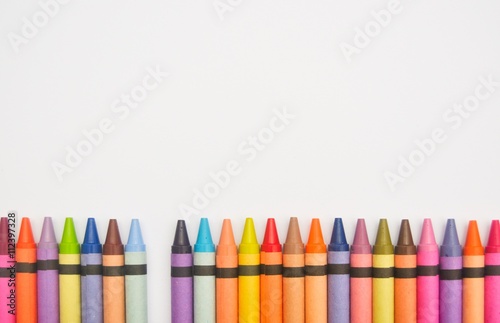 Crayons lined up in a row with one missing