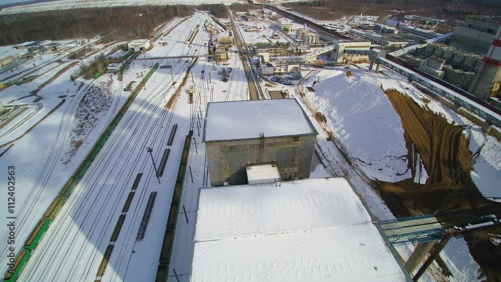 The white surroundings on the industrial plant lots of snow on the area of the wide plant The white surroundings on the industrial plant lots of snow on the area of the wide plant