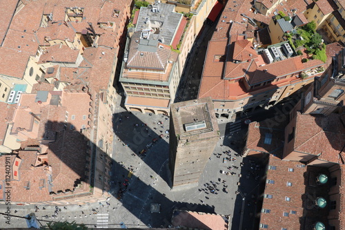 Bologna in Italy, view to Tower Garisenda at Piazza di Porta Ravegnana from Tower Asinelli  photo