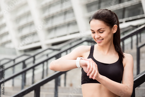 Woman looking at her watch Free Download Woman looking at her watch - GFXLoad