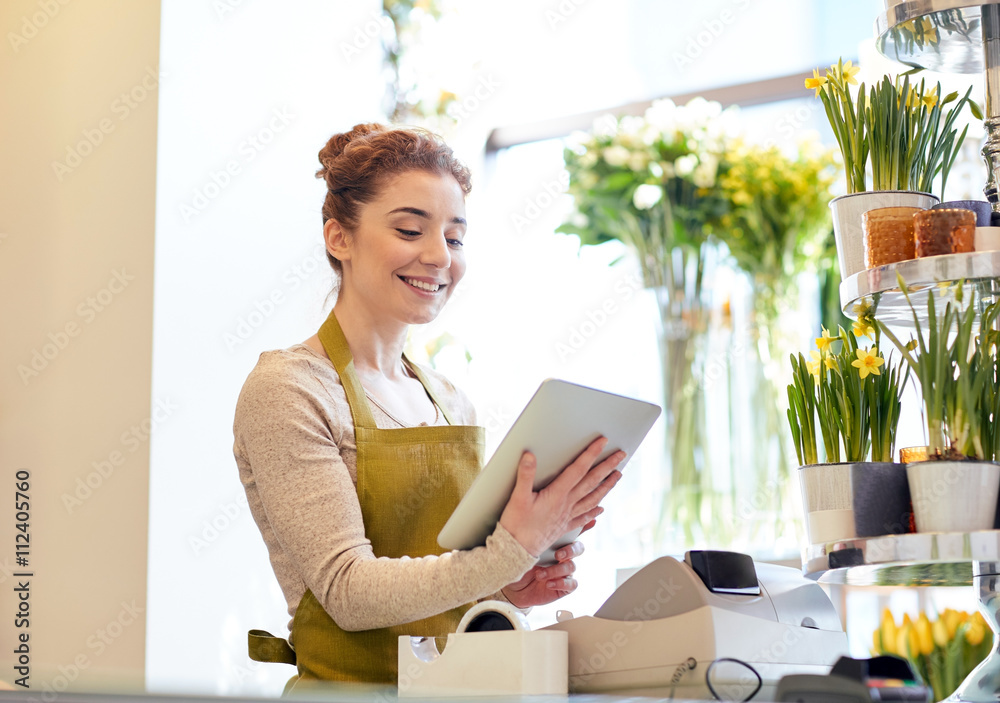 woman with tablet pc computer at flower shop woman with tablet pc computer at flower shop