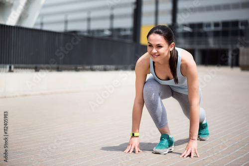 Woman at start position to run