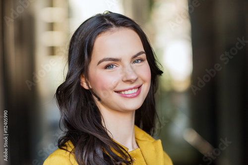smiling young woman in city