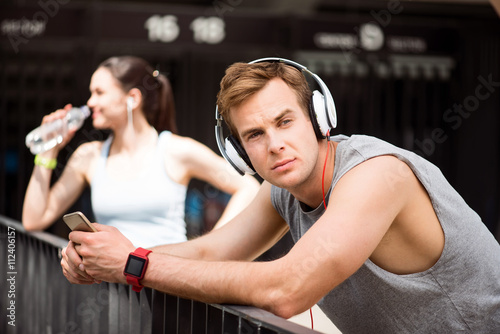 Fototapeta Naklejka Na Ścianę i Meble -  Man listening to music through a headset
