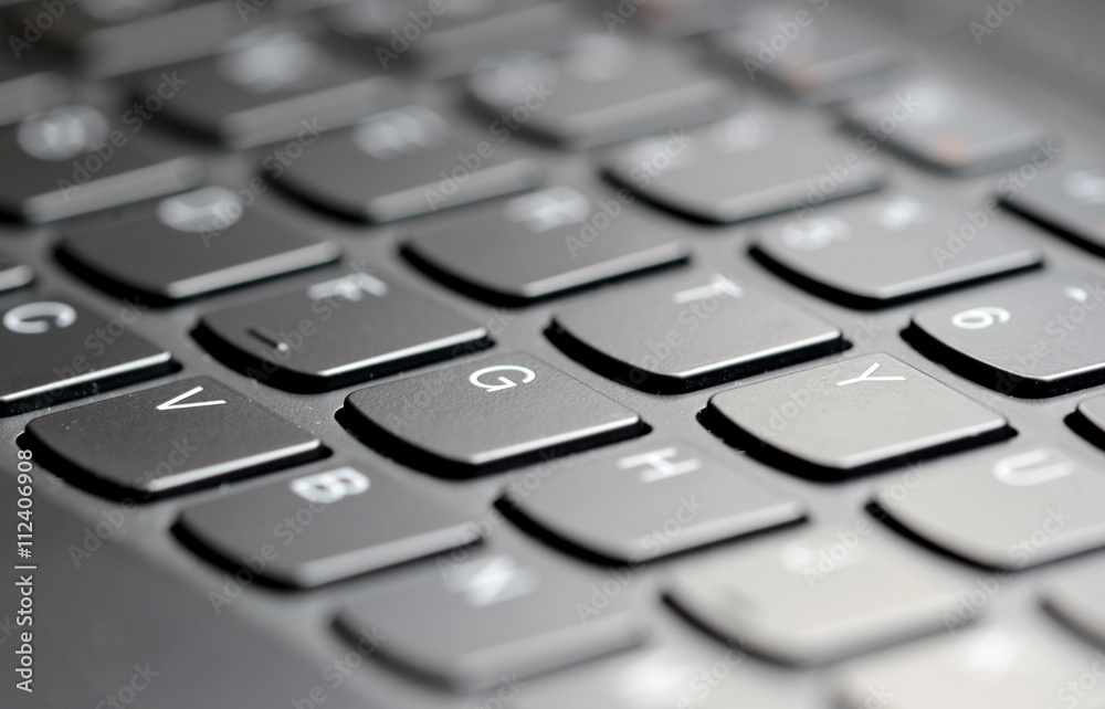 Closeup of computer keyboard keys with narrow focus and selectively blurred background Closeup of computer keyboard keys with narrow focus and selectively blurred background