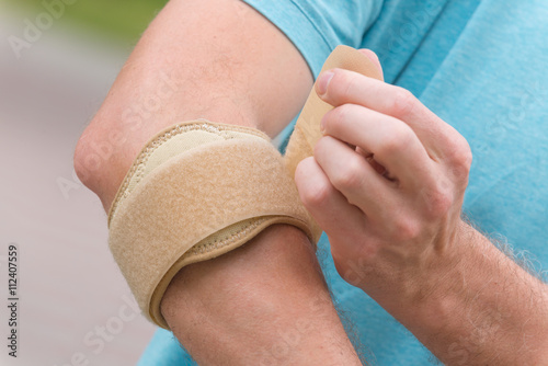 Photography Man wearing elbow brace