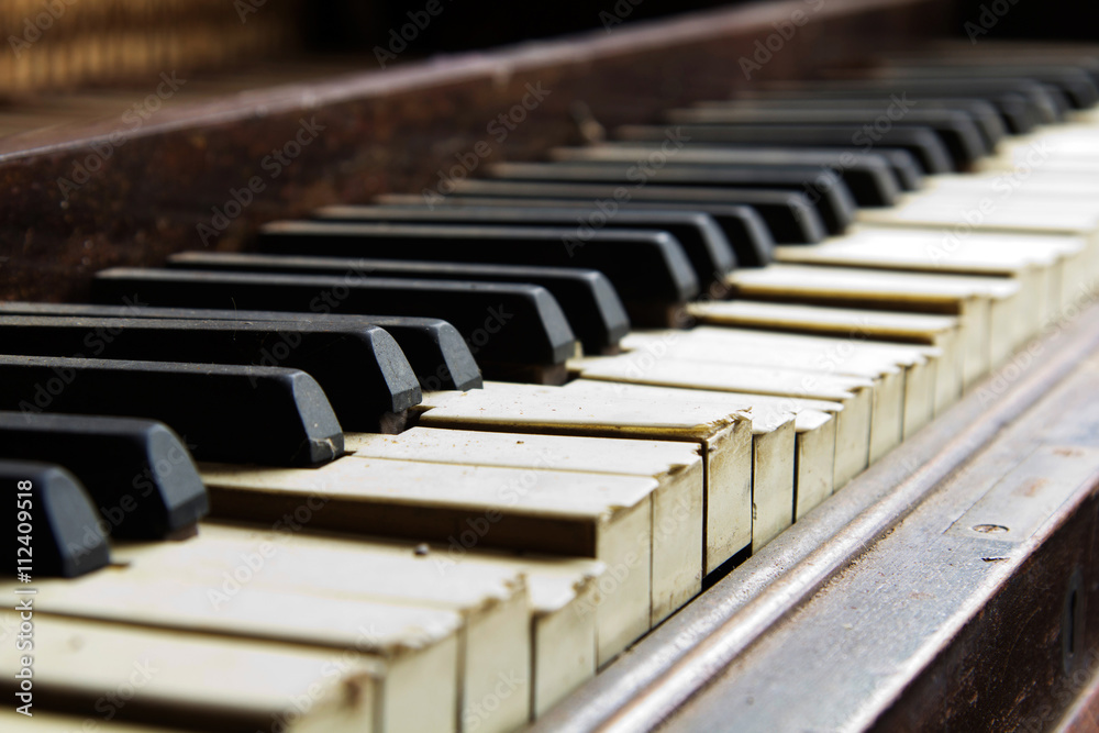 Old broken disused piano with damaged keys Old broken disused piano with damaged keys
