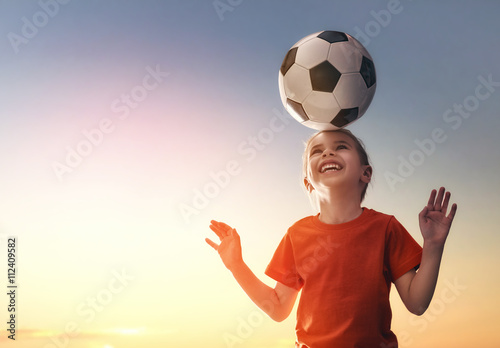 Girl plays football. photo