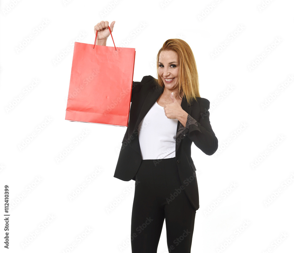 attractive blond businesswoman holding red shopping bag smiling happy and satisfied in sales concept attractive blond businesswoman holding red shopping bag smiling happy and satisfied in sales concept
