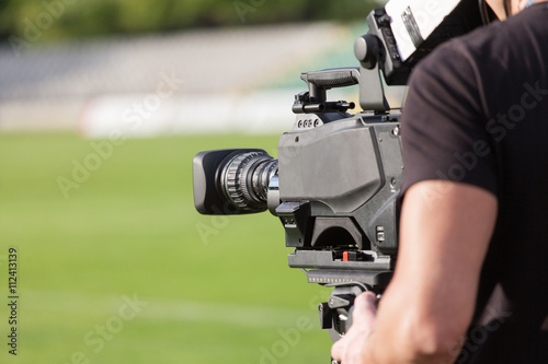 Tv camera broadcasting during a football (soccer) match
