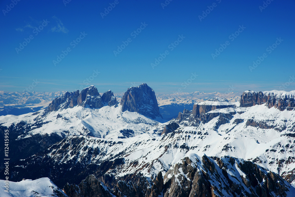 Fototapeta premium Scenic view on snowy peaks in italian dolomiti alps on a sunny day. Arabba Marmalada 