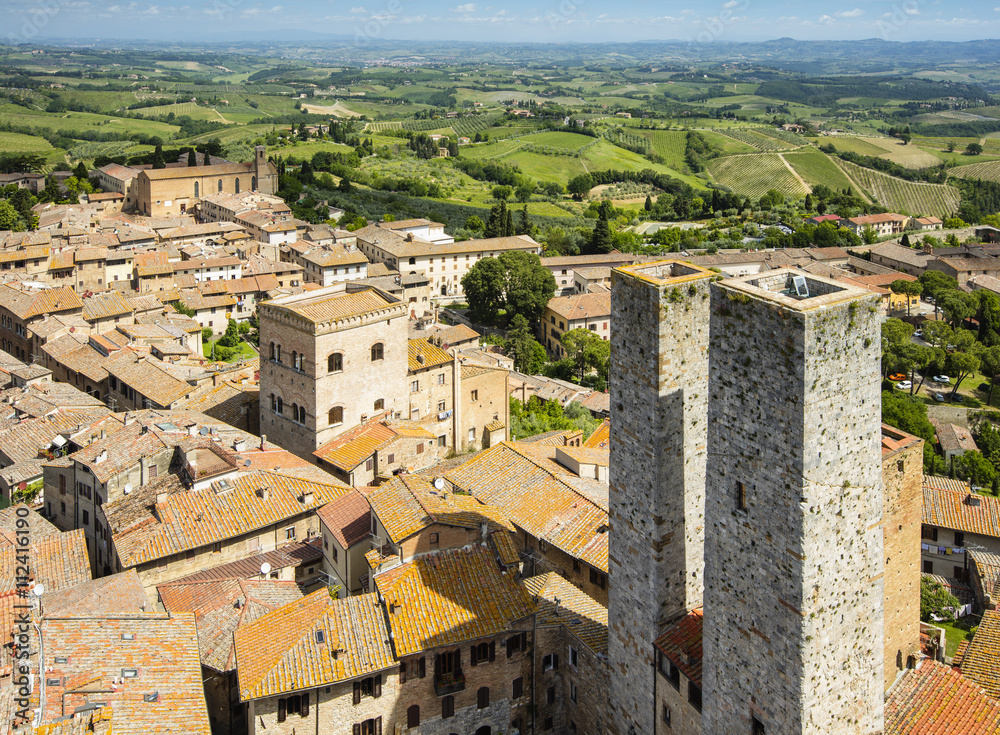 aerial view to two towers and old city in summer day  in Tuscany in Italy