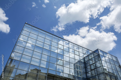 Building facade with blue sky and white clouds