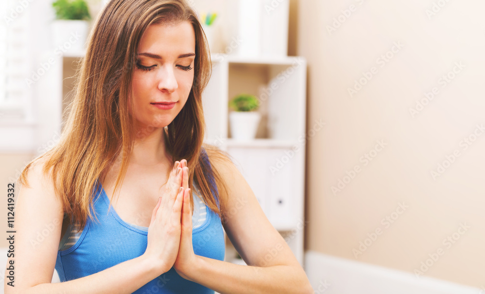 Young woman practicing meditation Young woman practicing meditation