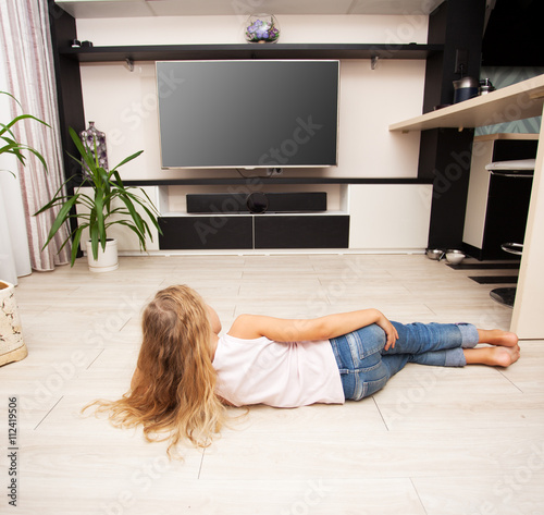 Child watching TV at home