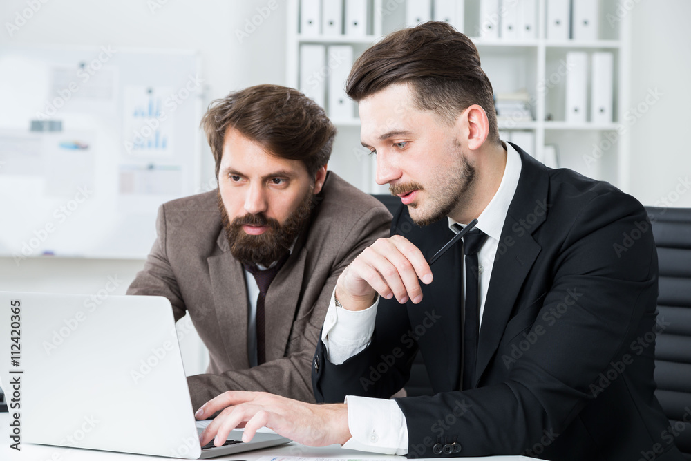 Two businesspeople discussing business project