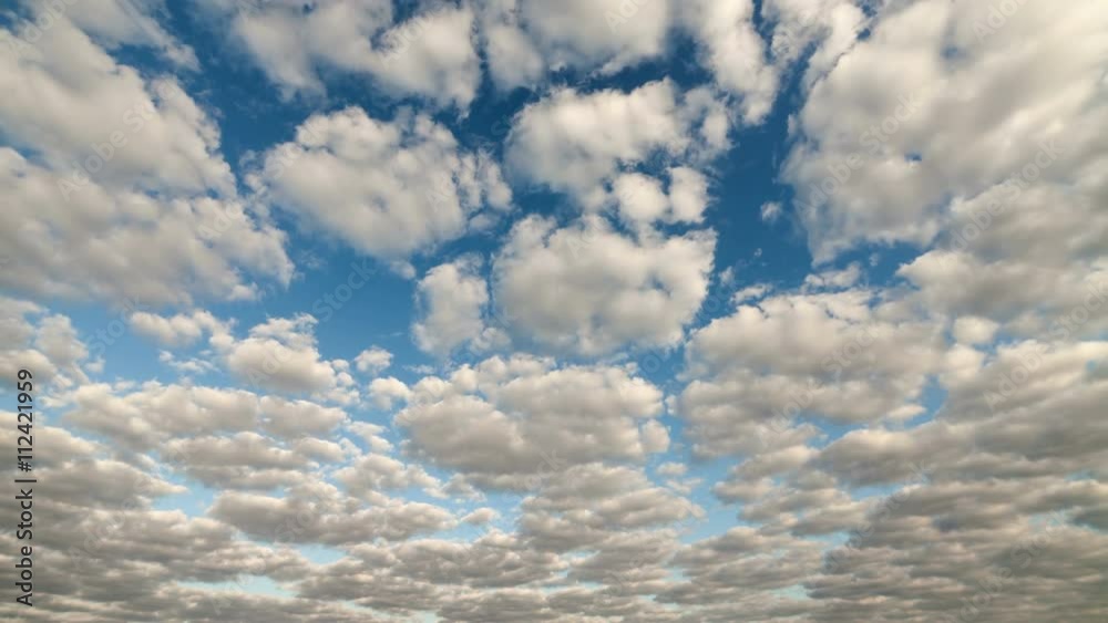 White clouds running over blue sky