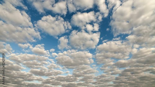 White clouds running over blue sky