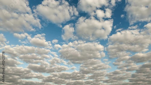 White clouds running over blue sky