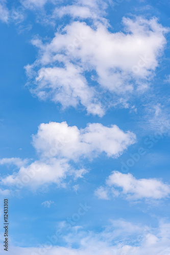 White clouds against blue sky.