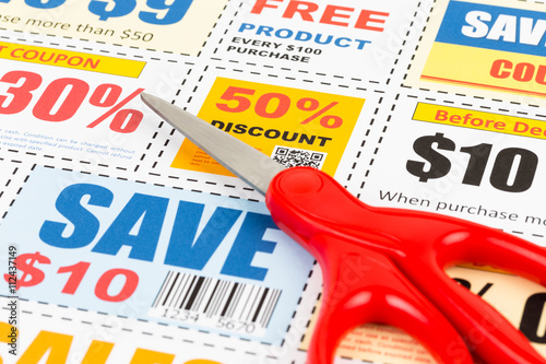 Saving discount coupon voucher with scissors, coupons are mock-u