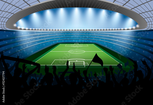 Excited crowd of people at a soccer stadium. Football stadium.